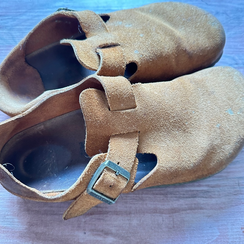 Birkenstock tan suede clogs.